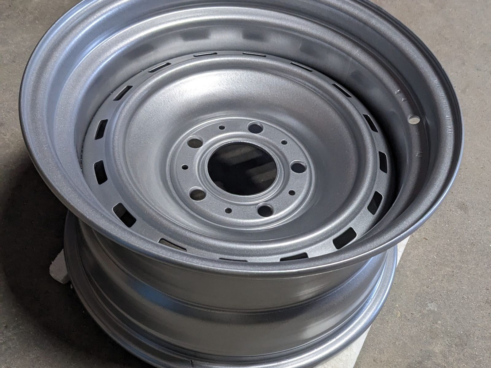 Bare steel wheel after sandblasting, ready for coating