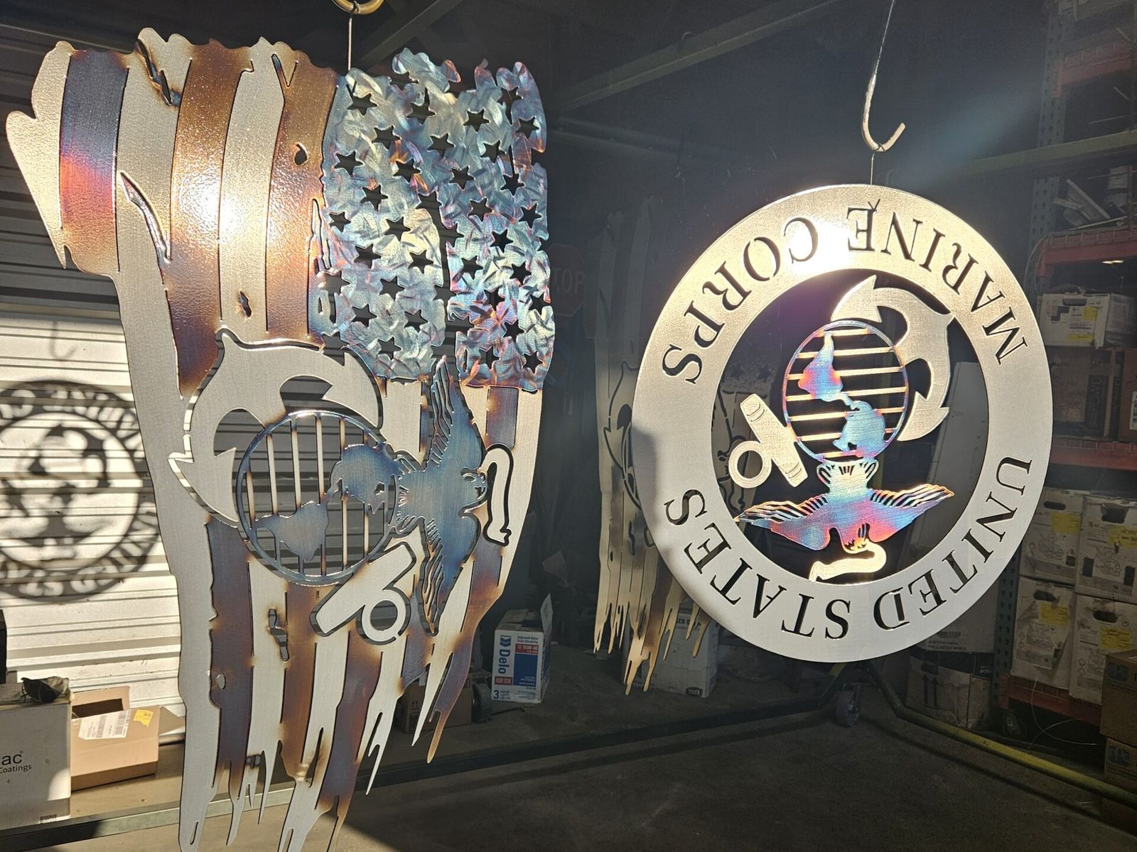 Custom cut and coated metal signs and artwork in the shop